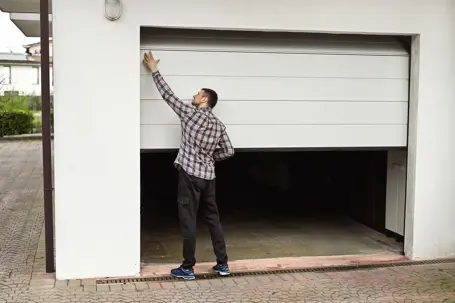 man checking a garage door